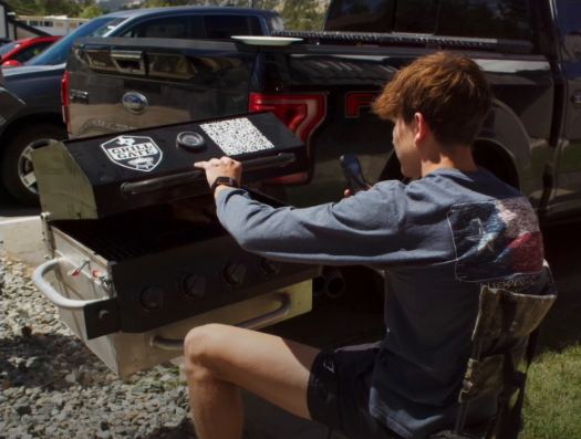 Cooking outdoors on the GrillGate tailgate-side