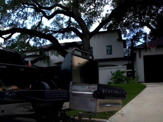 Prototype GrillGate with the swing arm extended at dusk