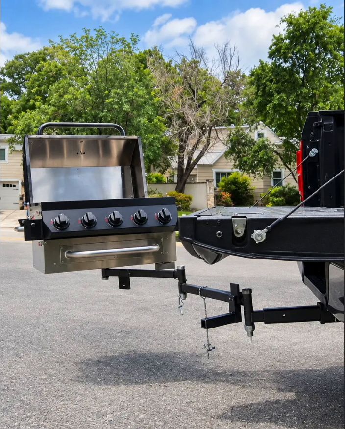 GrillGate mounted on a truck hitch, folded and ready to roll